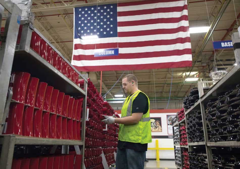 Manufacturing Worker With Flag in Background
